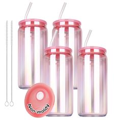 four clear jars with straws and lids are shown next to each other, one has a pink lid