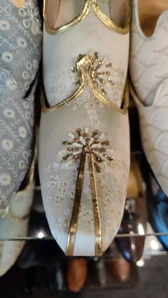 several pairs of ballet shoes are on display