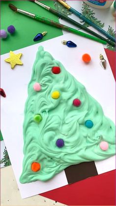 a christmas tree made out of green frosting on top of a piece of paper