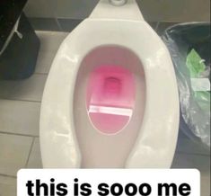 a white toilet with a pink seat and the words this is sooo me on it