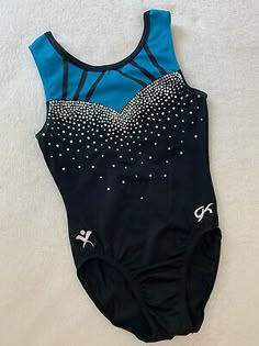 a black and blue leotard with white stars on it