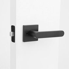 an open door with a black handle on it