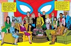 a group of people sitting around a living room in front of a spider - man