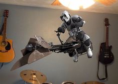 an image of a robot that is in the air above some drums and guitars on a wall