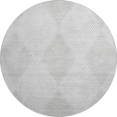 a round rug with white dots on it