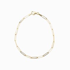 "Simple and delicate bracelet perfect for everyday wear. This bracelet is both dainty and comfortable, making it an ideal addition to any outfit. This paperclip chain bracelet is a stylish and modern piece of jewelry that features a chain made up of interlocking paperclip-shaped links. This type of bracelet is typically crafted from 14 karat gold, which is a high-quality and durable material that is prized for its rich, warm color and lustrous finish. The bracelet is designed to be lightweight and comfortable to wear, making it ideal for everyday use or special occasions. With its sleek and contemporary design, a 14k gold paperclip chain bracelet is a versatile accessory that can be dressed up or down to suit any style. * Made of 14k solid gold * Bracelet length: 7\" * Lobster clasp" Classic Gold Bracelet With Rectangular Links For Everyday, Elegant Paperclip Bracelet With Cable Chain For Everyday, Minimalist Gold Bracelet With Oval Links, Minimalist 14k Gold Oval Link Bracelets, Delicate 14k Gold Chain Bracelet For Everyday, Minimalist Chain Bracelet With Lobster Clasp For Formal Occasions, Timeless Gold Chain Paperclip Bracelet As Gift, Gold Minimalist Paperclip Bracelet For Everyday, Timeless Paperclip Gold Chain Bracelet As Gift