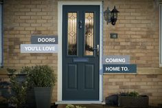 a front door with some signs on the side of it that say doors you'll love coming home to