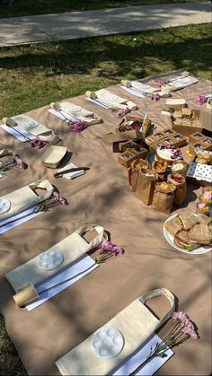 a picnic table set up with plates and napkins