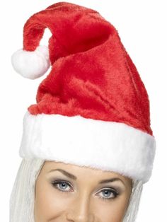 a woman wearing a santa hat with white hair