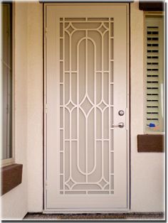 a white door with a glass design on it