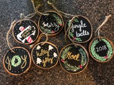 six decorated cookies with chalkboard sayings are sitting on the counter top next to each other