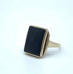 The past will always return in the fashion world and this piece is back for round two! In the 1920's ladies of class wore the most opulent dresses with jewelry to match. As the years continued, jewelry makers tailored pieces to fashion and trends which resulted in affordability for style. Presenting this fantastic Vintage 14k Gold Square Black Onyx Shield Statement Ring Featuring Eclectic Step Inspired Design. Unfortunately this piece is not marked but has been tested and confirmed a minimum of Classic Black Onyx Signet Ring, Antique Rectangular Jewelry For Formal Occasions, Antique Rectangular Formal Jewelry, Art Deco 14k Gold Rectangular Jewelry, Classic Rectangular Jewelry For Formal Occasions, Formal Victorian Jewelry With Rectangular Shape, Evening Jewelry In 14k Gold With Black Enamel, Evening 14k Gold Jewelry With Black Enamel, Elegant Gemstone Signet Ring For Formal Occasions