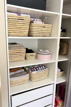 an organized closet with baskets and other items