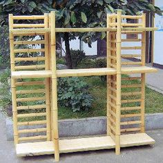 two wooden shelves sitting next to each other on the sidewalk