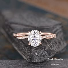 a rose gold engagement ring with a round diamond