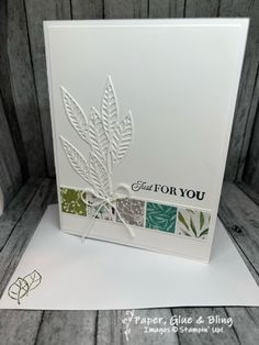 a close up of a card with leaves on it