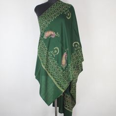 Kashmiri sozni Embroidered Wool Stole.This Multi Color Stole Is Made Of Fine Merino Wool Its Embroidered With Multi Colours.The Embroidery Done On This Is A Traditional Kashmiri Embroidery Known As 'sozni Work''.Now Own A Rare Genuine Kashmiri Hand Embroidered Stole Which Takes Many Months To Create, Unique In Design And Colour And, Have Never Been Replicated. Condition: Brand New Size: 28" X 80" (70 Cm X 200 Cm) Approx Colour: Green Style: Scarf Wrap Material: Fine Merino Wool Embroidery:  sozni Work (needle work) Washing : Hand Wash Only (Use Cold Water) Ironing: Use Steam Ironing Free Shipping : Yes Elegant Green Embroidered Shawl, Green Embroidered Bohemian Shawl, Elegant Embroidered Green Traditional Wear, Traditional Embroidered Green Shawl, Bohemian Green Pashmina Shawl In Traditional Drape, Green Shawl With Resham Embroidery In Traditional Drape, Embroidered Green Shawl Dupatta, Green Embroidered Shawl Dupatta, Green Pashmina Shawl For Wedding