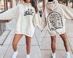 two women wearing hoodies that say jesus and flower