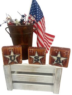 an american flag and some patriotic decorations on a white background with a bucket full of stars