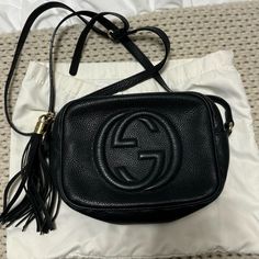 Pre-Owned Gucci Soho Disco Bag In Black With Gold Hardware. Inside In Good Condition With A Few Light Stains. Outside Overall Still In Good Condition. The Corners Of Bag In Front Very Worn But Hard To Tell From Far Away. Great Crossbody. Perfect For Everyday Or A Night Out. Can Fit Alot! Black Gucci Bag With Logo, Gucci Soho Disco Bag, Soho Disco Bag, Gucci Soho, Gucci Soho Disco, Bags Gucci, Light Stain, Gucci Bags, Soho