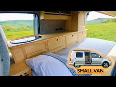 the interior of a camper with a small van bed