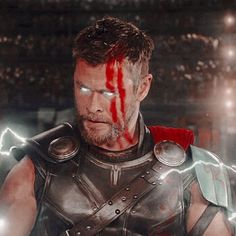 a man dressed as thor with lightning in the background