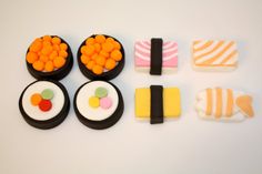 there are many different types of sushi on the table, and one is made out of fondant