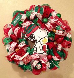 a christmas wreath with a snoopy dog on it