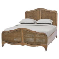 a bed with wicker headboard and foot board, made in the style of an old