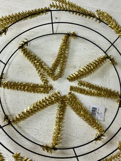 gold tinsel christmas tree decorations in a circle