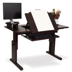 a computer desk with a monitor, keyboard and pencils on it in front of a white background