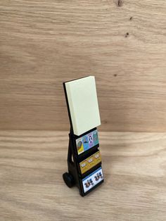 a stack of cards sitting on top of a wooden table