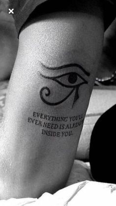 an egyptian eye tattoo with the words everything you ever need is already inside you on someone's leg