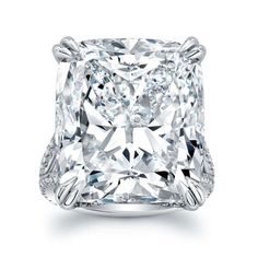 a cushion - cut diamond ring set in 18k white gold