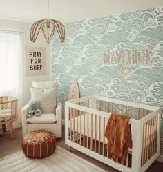 a baby's room decorated in blue and white