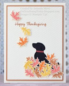 a thanksgiving card with a black dog and fall leaves