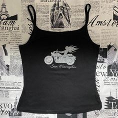 This Graphic Tank Top From Star Motorcycles Is Amazing! It’s Deadstock/Brand New With Tags From The Early 2000s/Y2k. It’s Black And Has A Silver Glitter Graphic Of A Woman Riding A Motorcycle On The Front. The Glitter Has Some Fallout, So Beware Of That. It’s In Great Condition With No Rips, Stains, Or Tears. Tagged As A Large Measurements Bust (Underarm To Underarm): ~15.5 In Flat/31 In Bottom Opening: ~15.5 In Flat/31 In Length (Shoulder To Bottom): ~21 In Y2k Graphic Tank Top, Silver Tank Top, Star Motorcycles, Tank Top Y2k, Riding A Motorcycle, Purple Tank, Sequin Tank, Tunic Tank Tops, Back Women