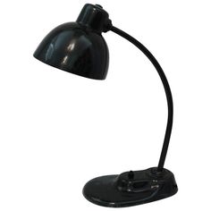 a black desk lamp on a white background