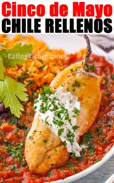 a white plate topped with food and garnished with parsley next to a glass of beer