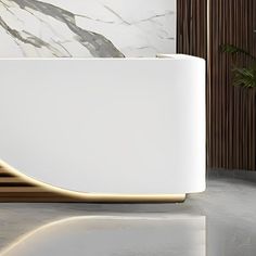 a white bath tub sitting next to a wall with wood trimmings on it