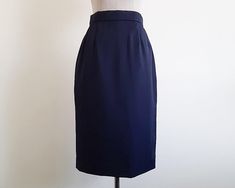 Vintage Navy Blue Skirt - Label : LANVIN  - Fabric : 100% wool - Nylon zipper on the back - Lined - Made in France Good vintage condition but the skirt has a small hole. Please see the two last photos. Measurements : Waist : 25.5" Hips : 37" Total length : 27" Our products are vintage clothing that will be cleaned so you can be confident in the quality. We carefully inspect each garment to make sure that you get the most accurate and informed description possible. We do our best to state any imperfections in the listing. If a flaw accidentally escapes our inspection, please let me know as soon as possible and we will be happy to help remedy the situation. Please read the product description carefully before purchasing to ensure it meets your needs. If you have any questions, please feel fr Vintage Fitted Mini Pleated Skirt, Fitted Vintage Mini Pleated Skirt, Blue Fitted Midi Skirt, Elegant Blue Fitted Skirt, Elegant Fitted Blue Skirt, Fitted Vintage Blue Skirt, Blue Fitted Long Skirt, Fitted Long Blue Skirt, Formal Fitted Full Mini Skirt