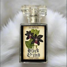 Black Orchid Perfume Spray 1 oz bottle Notes: Orchid - jasmine - night blooming florals - black amber - patchouli - Madagascar vanilla.*Perfume Spray contains essential oils, absolutes/ fine fragrance oils, organic perfumers alcohol and gemstones.Phthalate-freeCruelty- freeVeganOrganicAvoid contact with eyes. Keep away from small children and pets. These products are for external use only.If irritation occurs, discontinue use immediately and contact your physician or health care provider. Black Orchid Perfume, Orchid Perfume, Vanilla Perfume, Rituals Set, Madagascar Vanilla, Silver Caps, Essential Oil Perfume, Black Orchid, Luxury Fragrance