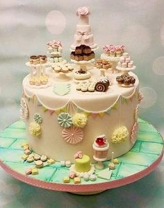 there is a cake that has many cupcakes on the top and bottom tier