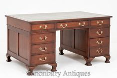 an antique desk with two drawers on each side