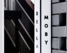 the words mosby are written on the side of a building