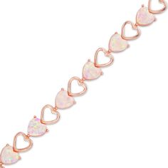 She’ll instantly adore the blissful anytime shimmer of this charming fashion bracelet. Crafted in sterling silver with precious 18K rose gold plate, this sweet and sassy choice features a series of alternating sideways heart links - some open, some embellished with a 6.0mm heart-shaped lab-created light pink opal cabochon. Buffed to a brilliant luster, this 7.25-inch bracelet secures with a box clasp. Rose Gold Plate, Box Clasp, Opal Bracelet, Gold Plated Bracelets, Pink Ring, Pink Stone, Pink Opal, Gemstone Bracelets, 18k Rose Gold