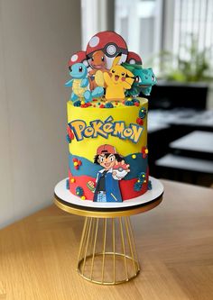 a pokemon themed cake sitting on top of a table