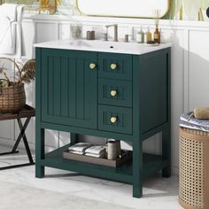 a bathroom with a sink and green cabinet