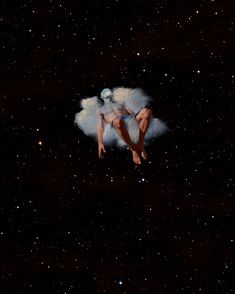 a man floating in the air on top of a cloud