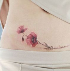 a woman's stomach with flowers on it